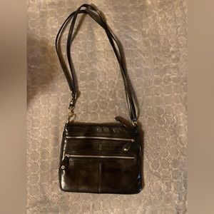 Classy leather purse Lots of pocket and zippers!! Great little bag. USED.
